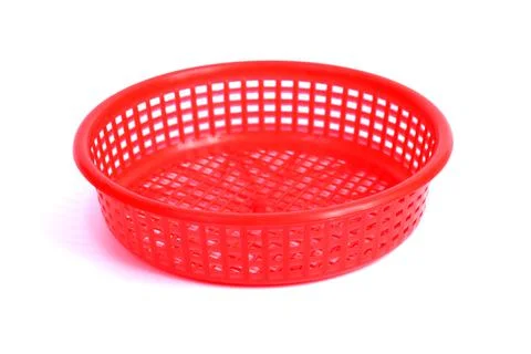 Red Round Plastic Basket, note select focus with shallow depth of field Stock Photos