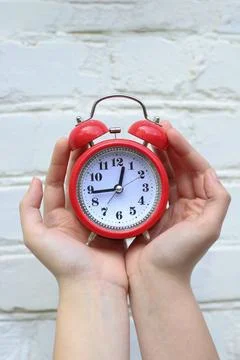 Red round table clock Stock Photos
