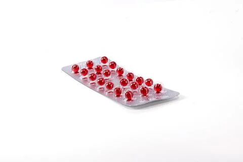 Red round tablets in an isolation stick Stock Photos