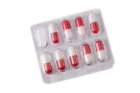 Red round tablets in an isolation stick Stock Photos