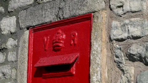 Red Royal mail Post box with V &amp; R Letters, Slow zoom in, bright sunny day Stock Footage 133726779
