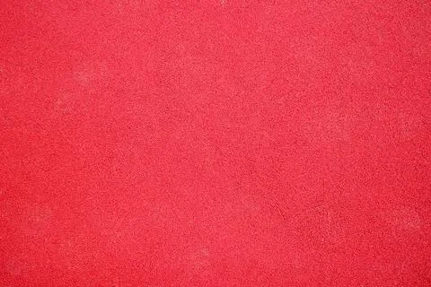 Red rubber coating of playground background. texture for design Stock Photos