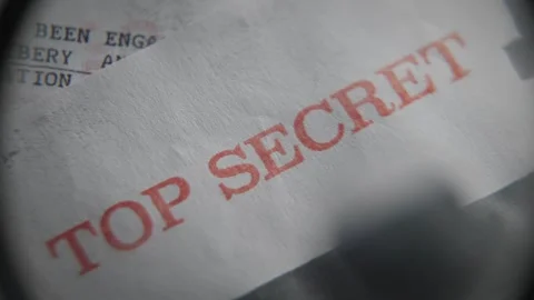 Red rubber stamp of Top Secret labeled on government confidential file document Stockbeeldmateriaal 334044902