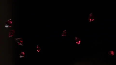 Red Rubies falling in slow motion 4K Stock Footage 253129441