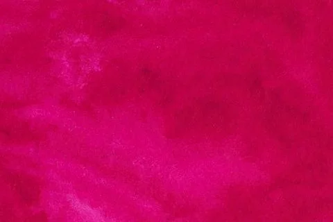 Red ruby color smeared on paper textured background. Stock Photos