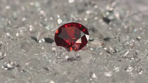 Red ruby diamond on a pile of white diamonds. Stock Footage 150715704