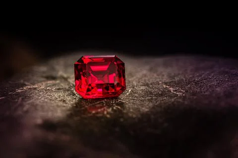 Red Ruby Precious Gemstone on Dark Background Stock Photos