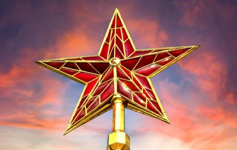 Red ruby star of Moscow Kremlin tower against the crimson sky Stock Photos