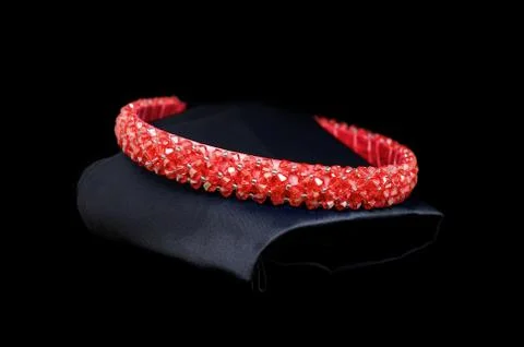 Red ruby tiara gemstones diamonds hair band on black background. Jewelry display Stock Photos