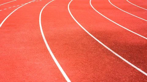 Red running track on athletic stadium background texture Stock Photos
