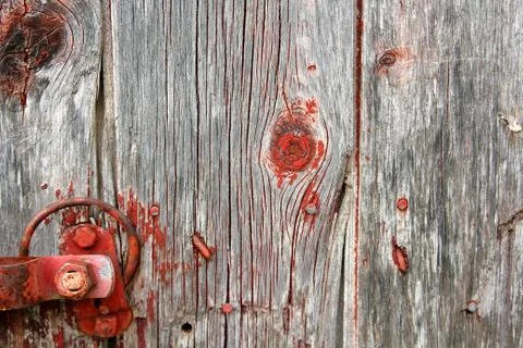 Red rustic barn wood background with latch hardware Stock Photos