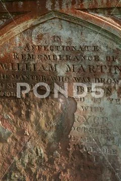 Red rusty weathered headstone in a Christian graveyard, Dumfries and Galloway Stock Photos