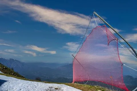 Red safety nets installed on ski slopes Stock Photos