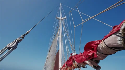 Red Sail and Mast from Deck in Open Ocean Stock Footage 337790026