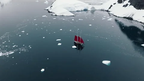 Red Sailed Ship Navigating Among Ice Floes Stock-Footage 343379560