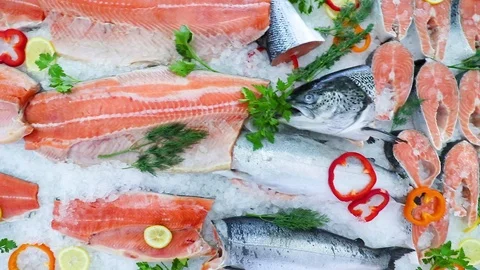 Red salmon fish on the counter of the store in the ice Stock Footage 104121289