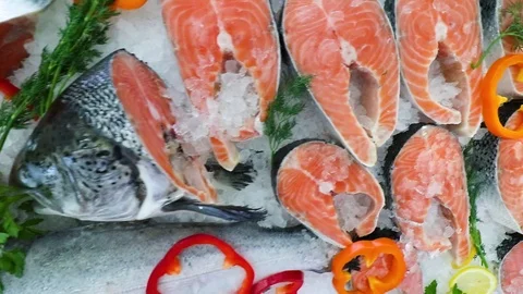 Red salmon fish on the counter of the store in the ice Stock Footage 104121291