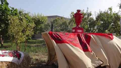 Red samovar sits on table 库存影片 334772248