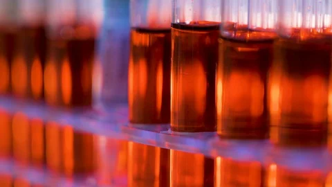 The red samples inside the tubes with the coronavirus or Covid-19 vaccine Stock Footage 129460838