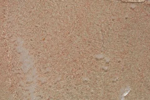 Red sand beach macro background creta island falassarna summer holidays 2020  Stock Photos