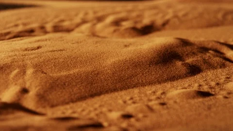 Red sand from the desert in Morocco, moving under vibration like in a Sandstorm Stock Footage 107263690