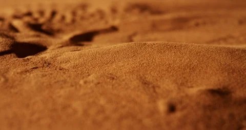 Red sand from the desert in Morocco, moving under vibration like in a Sandstorm Stock Footage 107266416