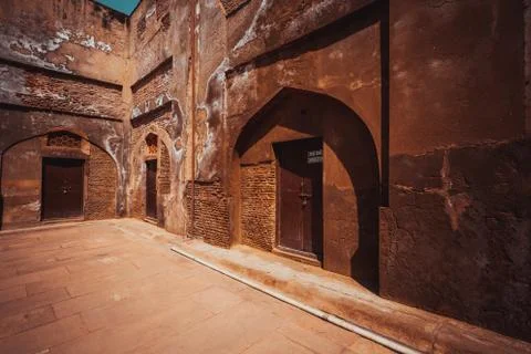 Red sand stone brick wall and wooden door 写真素材
