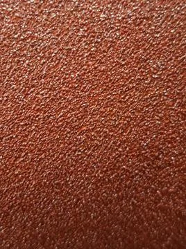Red Sandpaper Abrasive Texture Background 库存照片