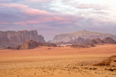 Red sands, mountains, dramatic sky and marthian landscape panorama of Wadi .. Stock Photos