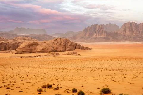 Red sands, mountains, dramatic sky and marthian landscape panorama of Wadi .. Stock Photos