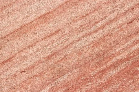 Red sandstone background texture. Abstract solid flat stone surface. Stock Photos