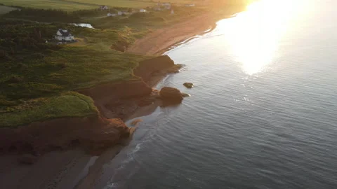 Red sandstone cliffs and coastal rocks at Thunder Cove, aerial view Vidéo 340514242