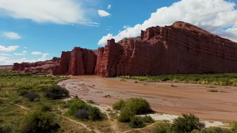 Red sandstone cliffs and desert riverbed, Salta, Argentina Stock Footage 332284076