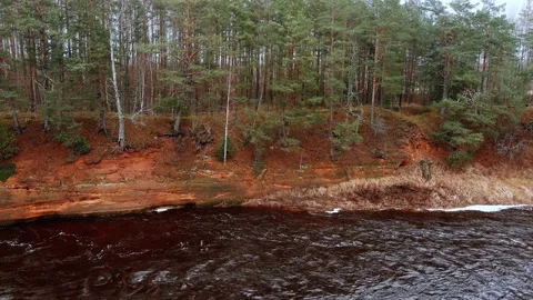 Red sandstone cliffs in the banks of river Salaca, Latvia 스톡 동영상 146060080