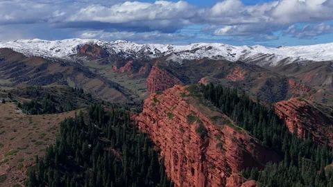 Red Sandstone Cliffs Jeti Oguz Kyrgyzstan Snow Peaks Drone View Stock Footage 324903095