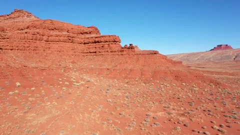 Red sandstone formations expanding across vast desert landscape Stock Footage 297605421