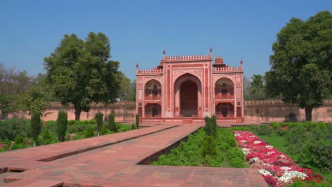 Red sandstone gatehouse and Charbagh gardens at Itimad ud Daulah Agra India 스톡 동영상 345001929