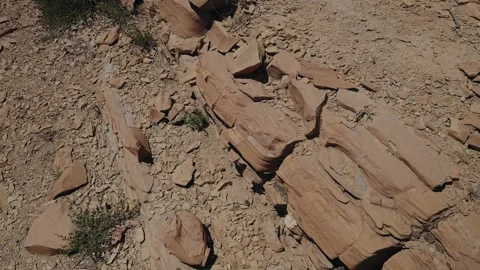 Red Sandstone Slabs and Dry Stony Ground on Arid Morocco Slope Stock Footage 340595867