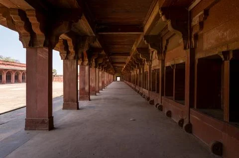 Red sandstone stable corridor with columns at Jodha Bai Palace, Fatehpur Sikri 写真素材