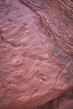 Red Sandstone Texture with Layered Rock and Subtle Dinosaur Tracks Nevada Stock Photos
