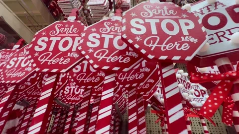 Red Santa Stop Here sign stands out as a Christmas decoration Stock Footage 289965804