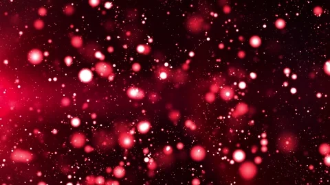 Red saw particles flying through space. There is a red light at the bottom left  Stock Footage 265609713