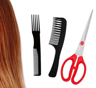 Red scissors, combs and brown hair isolated on white Foto stock