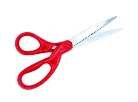 Red scissors on a white background Foto stock