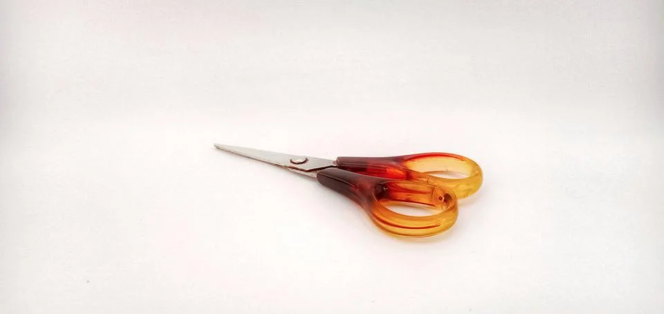 Red scissors on a white background Stock Photos
