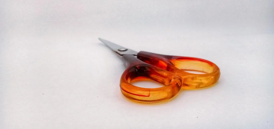 Red scissors on a white background Stock Photos