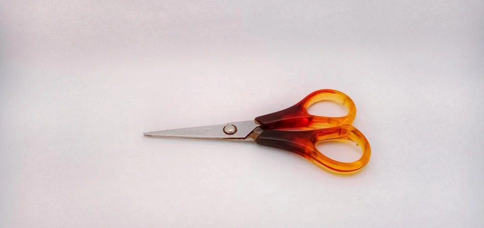 Red scissors on a white background Stock-Fotos