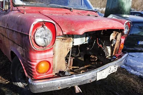 A red scrap car that lacks an engine and more Stock Photos
