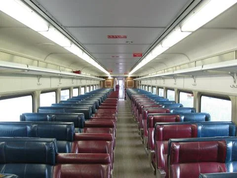 Red seats of an empty passenger train Stock Photos
