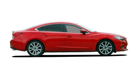 Red sedan, side view Stock Photos